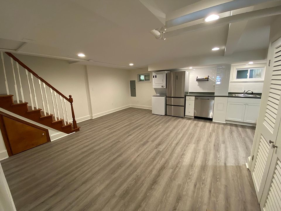 Living room space next to kitchen. This room has its own HVAC wall unit with remote control. There is also a washer/dryer.