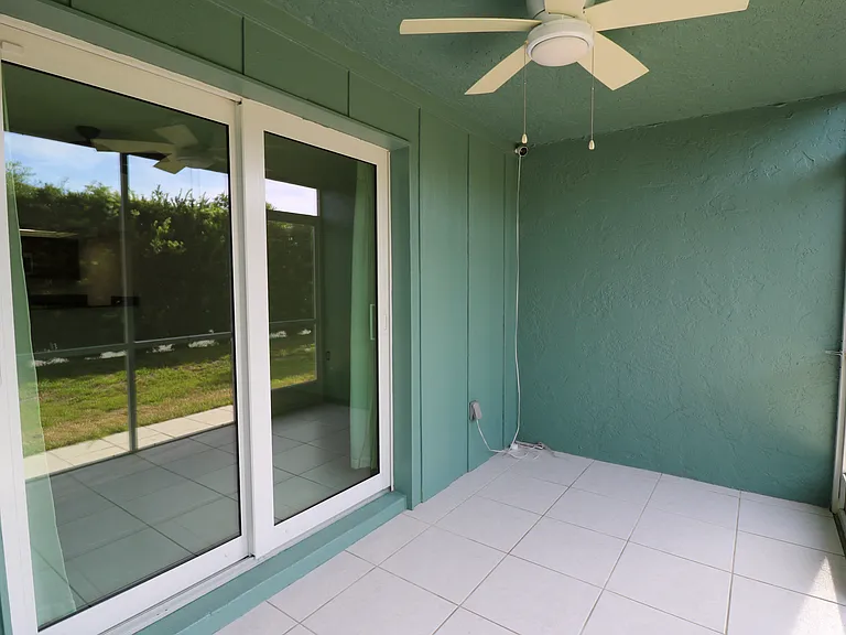 Lanai with impact glass sliders.