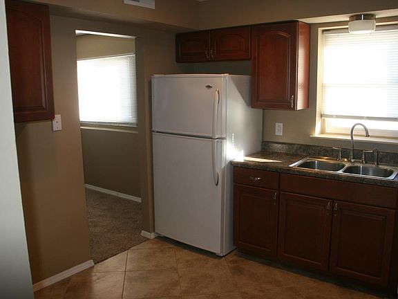 Kitchen w new cabinets and fridge