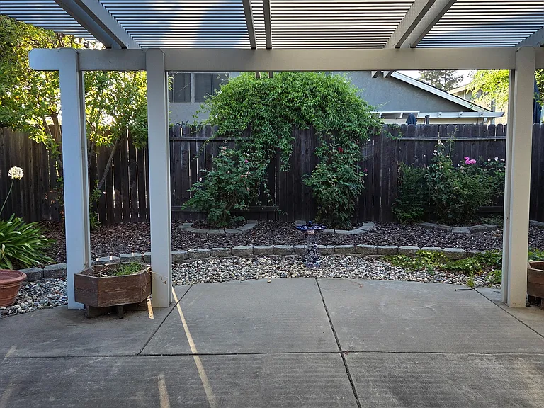 Enjoy your beautiful backyard with mature fruit trees: plum, peach, and apricot