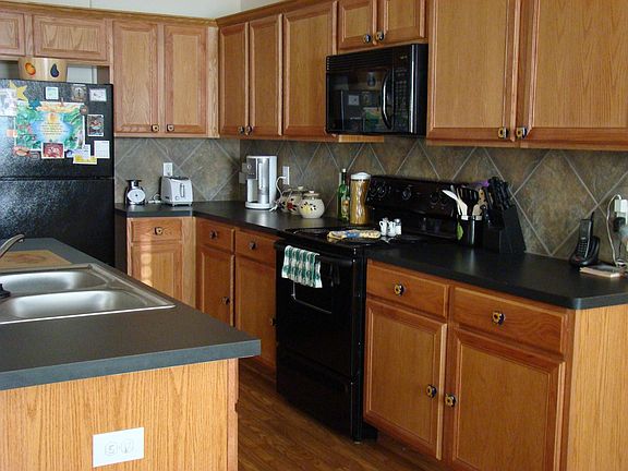 Lots of Cabinet Space in this Kitchen, with Island and Breakfast Bar