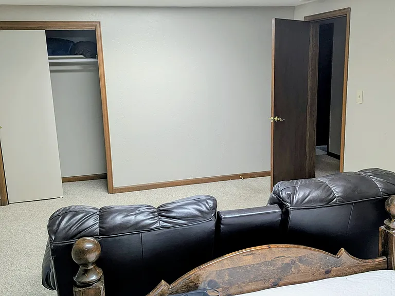 #1 bedroom South with sliding door closet, entry door.