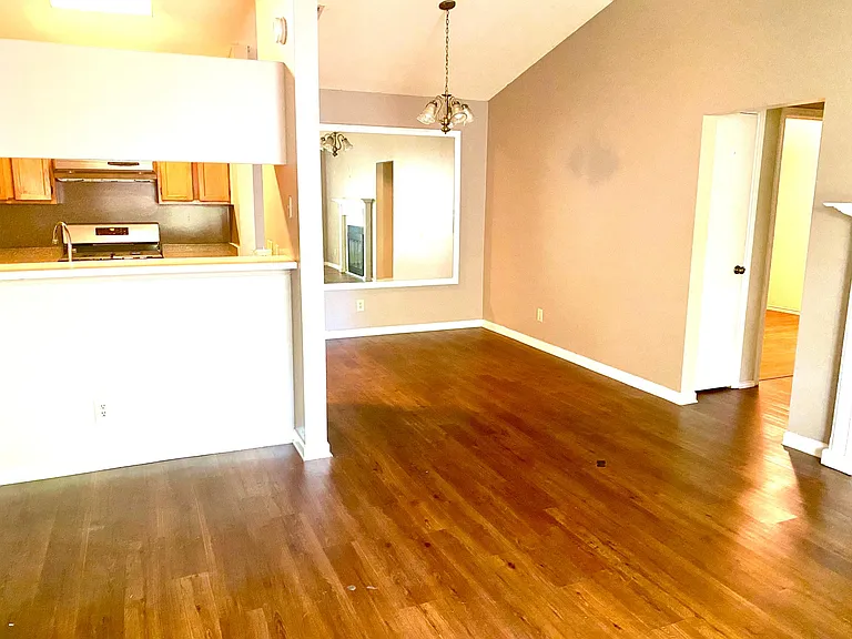 Kitchen left, dining area center 2 extra bedrooms right