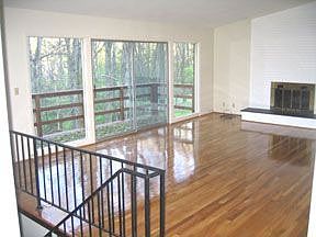 Stunning hardwoods and vaulted ceiling help bring the views of your mature tre