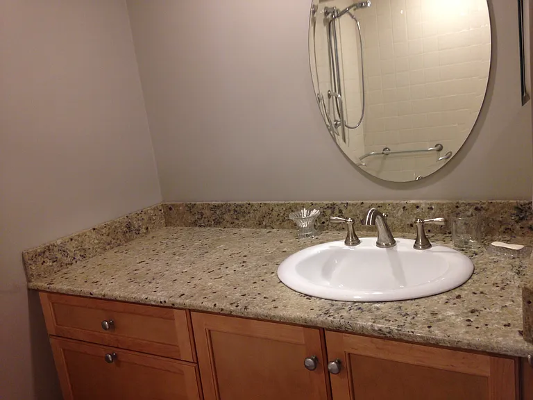 upgraded bathroom cabinets with granite
