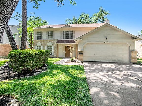 Mature trees and landscaping offers great curb appeal!