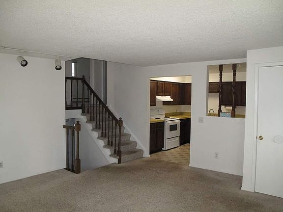 Stairs from living room and entry level upstairs