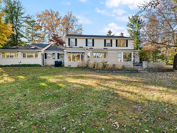 Expansive backyard with large patio, perfect for entertaining, relaxing, or family gatherings.