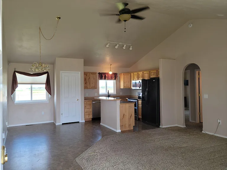 Living room, dining, kitchen with vaulted ceilings