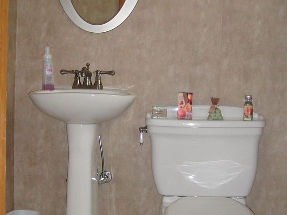 Upgraded half bath off den