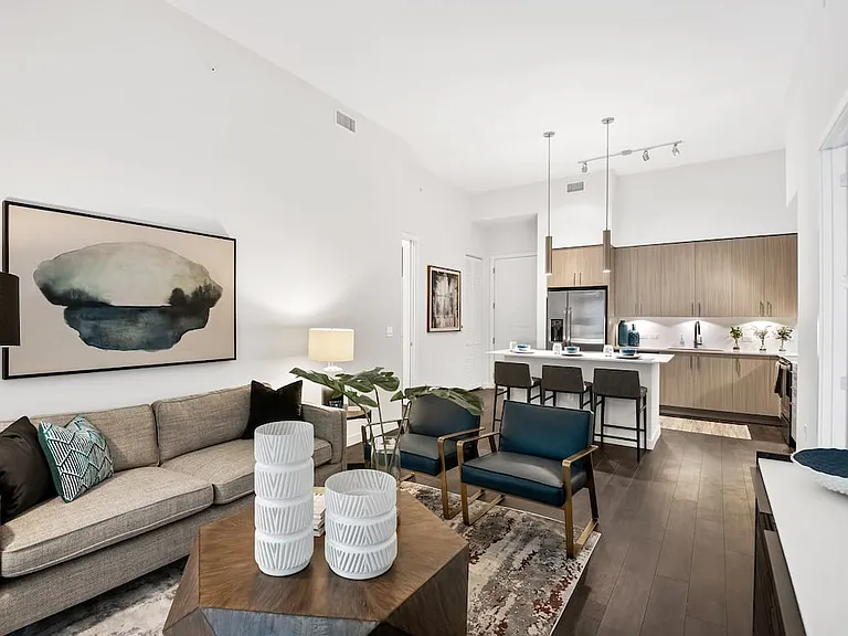 Kitchen, living, and dining areas with hard-surface vinyl plank flooring