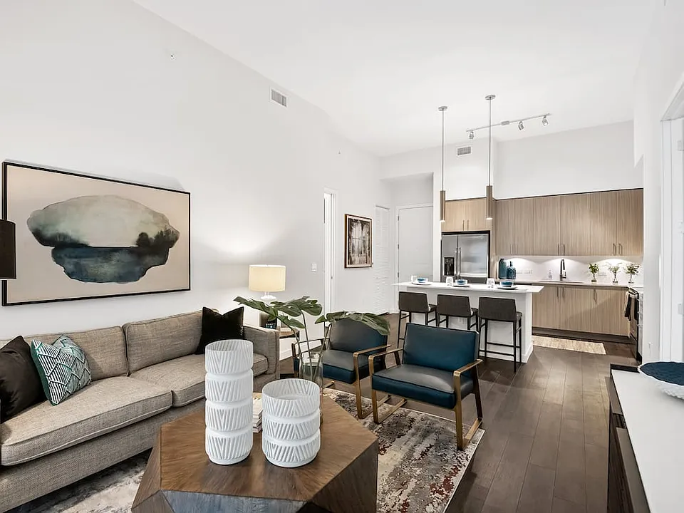 Kitchen, living, and dining areas with hard-surface vinyl plank flooring
