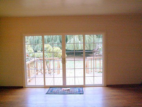 Living Room view through French Doors to Backyard