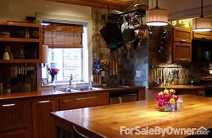 Slate tile and solid oak countertops
						:
						new in '09 custom handmade cabinets