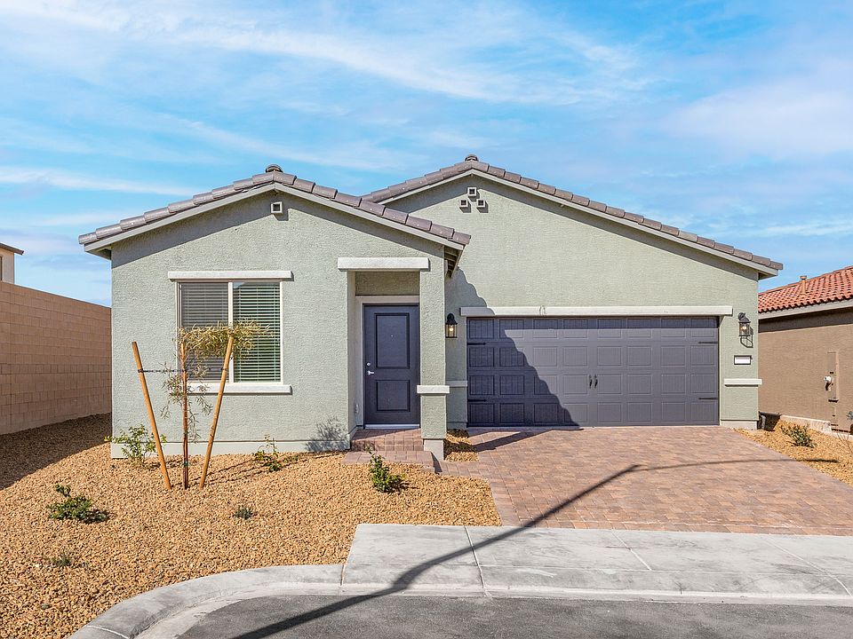 This home features a beautiful stucco exterior with a two-car garage.