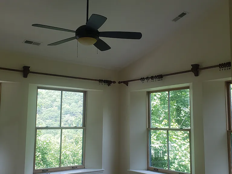 Master bedroom with private balcony looking towards river.