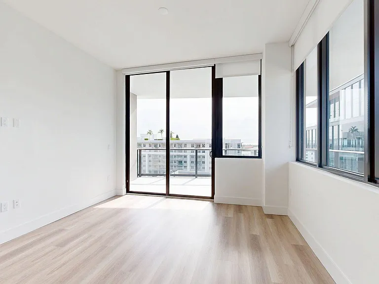 Apartment Living Room with hardwood floors and Balcony.