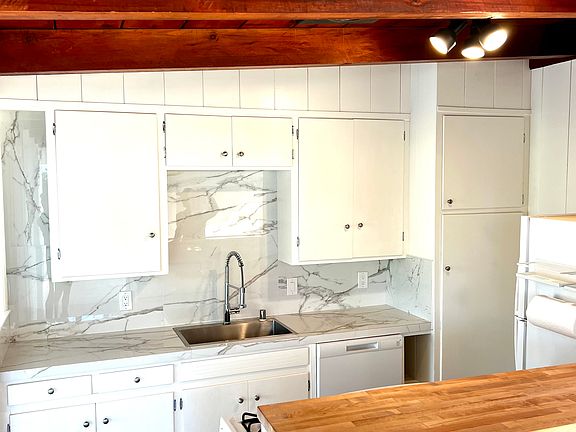 Completely renovated kitchen with new appliances and gas stove