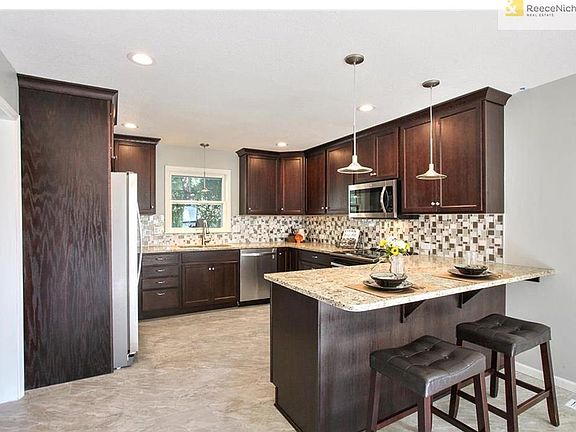 BRAND NEW KITCHEN! Cabinets, granite counters, beautiful backsplash, stainless appliances, sink, faucet, lights, tile floor. EVERYTHING NEW!!!