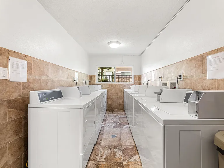 Laundry room with ample washers and dryers