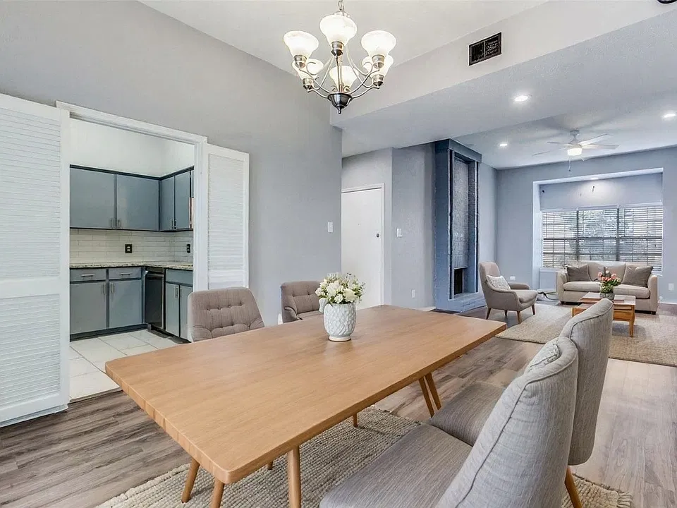 Dining/living room and kitchen shown with virtual AI staging.