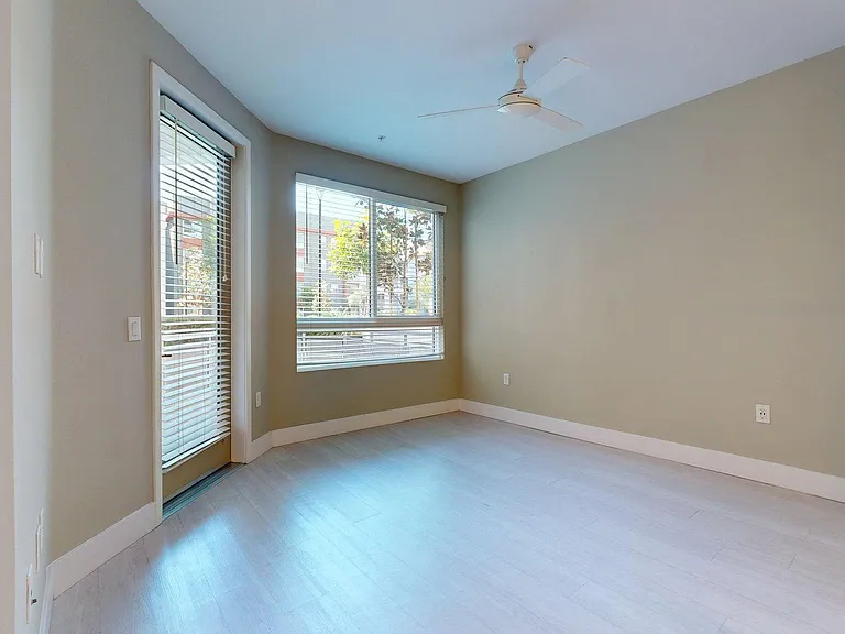 Apartment Living Room with Wood-Style Flooring and Patio/Balcony.