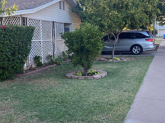 Second driveway on east side of house.