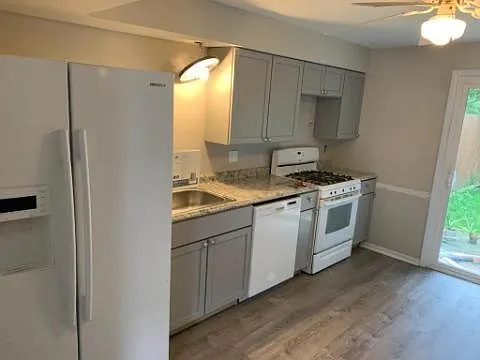 New kitchen with lots of storage and new life proof plank flooring thruout the house.
