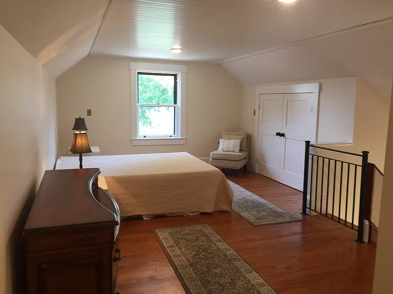 Third floor private suite with full bath. King bed. Fifth bedroom.