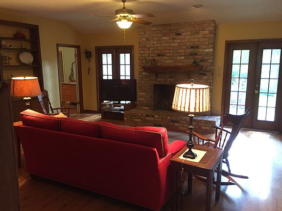 Den with large fireplace