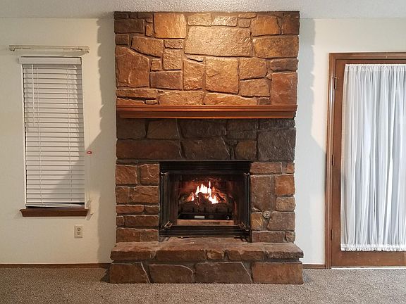 gorgeous rock fireplace with gas log insert
