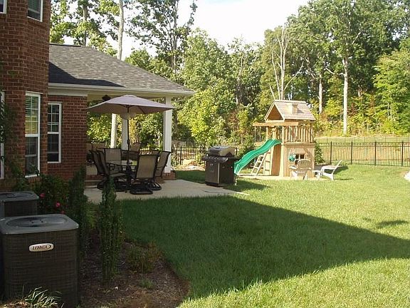 Rod Iron Fenced Backyard, Professional Landscaping, Gas Grill, Irrigation 