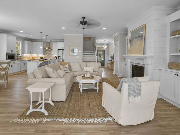 Fletcher floorplan 1st floor. (Our home has wood beams and a wood floating mantel. Large screen television will be mounted.)