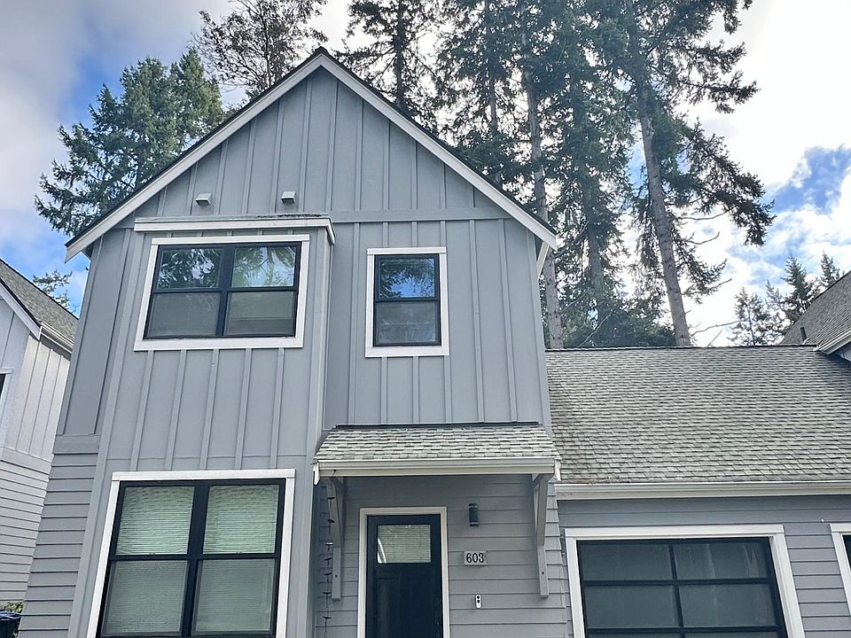 Beautiful town home with attached garage, extra parking, walk to stores, bars, ferry.