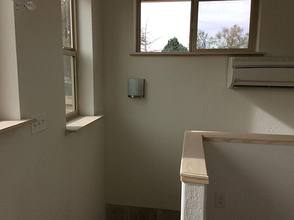 Top of stairs w/ a few of many windows