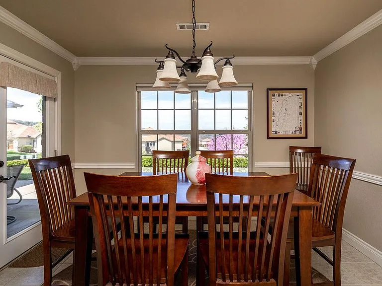 Dining table expands to seat 8.