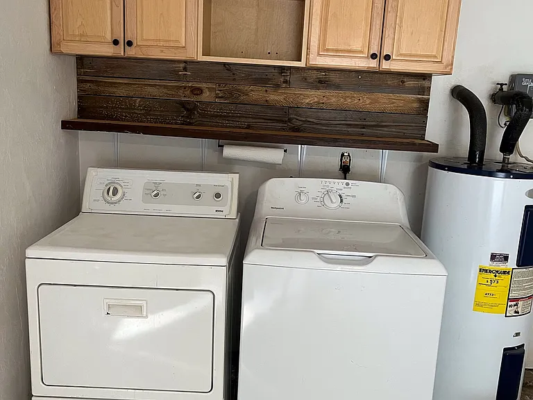 Laundry with storage for cleaners.