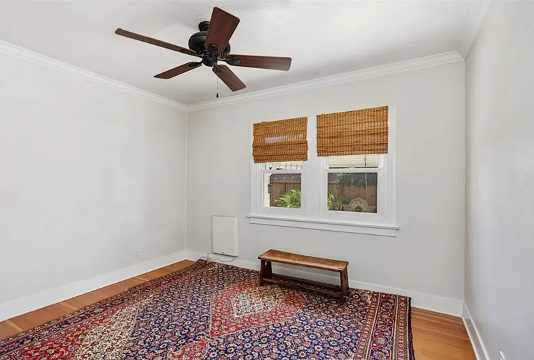 2nd bedroom with views of side patio