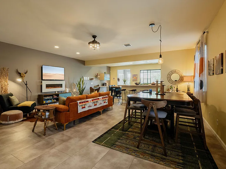 The house has an open floor plan that opens up right into the backyard gardens. It's an incredible space both day and night as the garden lights up as the sun goes down. Dine formally and informally inside or out.