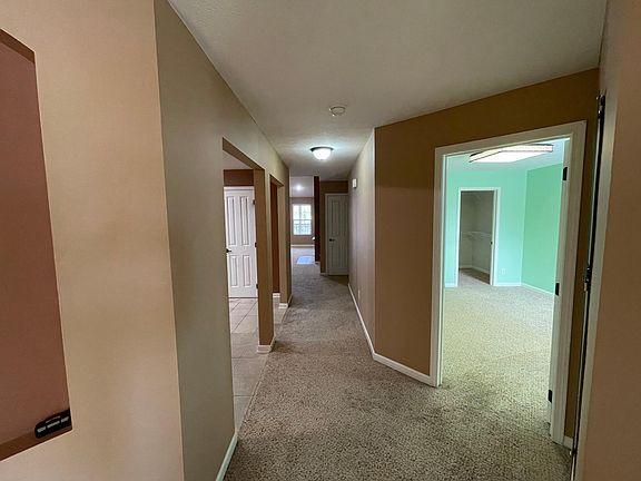 Walk away from the stairs leading to the kitchen and living space