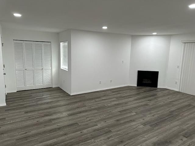 Entry into spacious living room. Hallway closet for coats and storage.