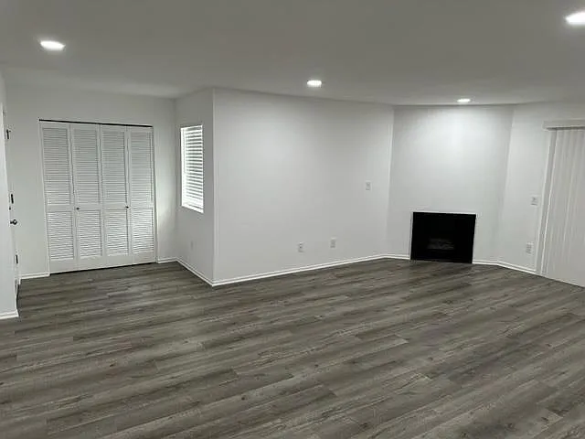 Entry into spacious living room. Hallway closet for coats and storage.
