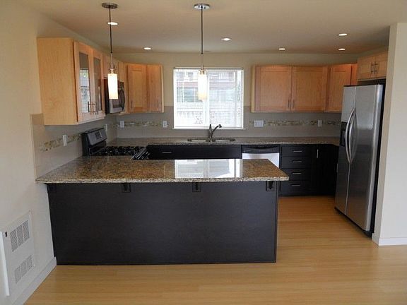 Slab Granite with Plenty of Counter Space and Cabinets