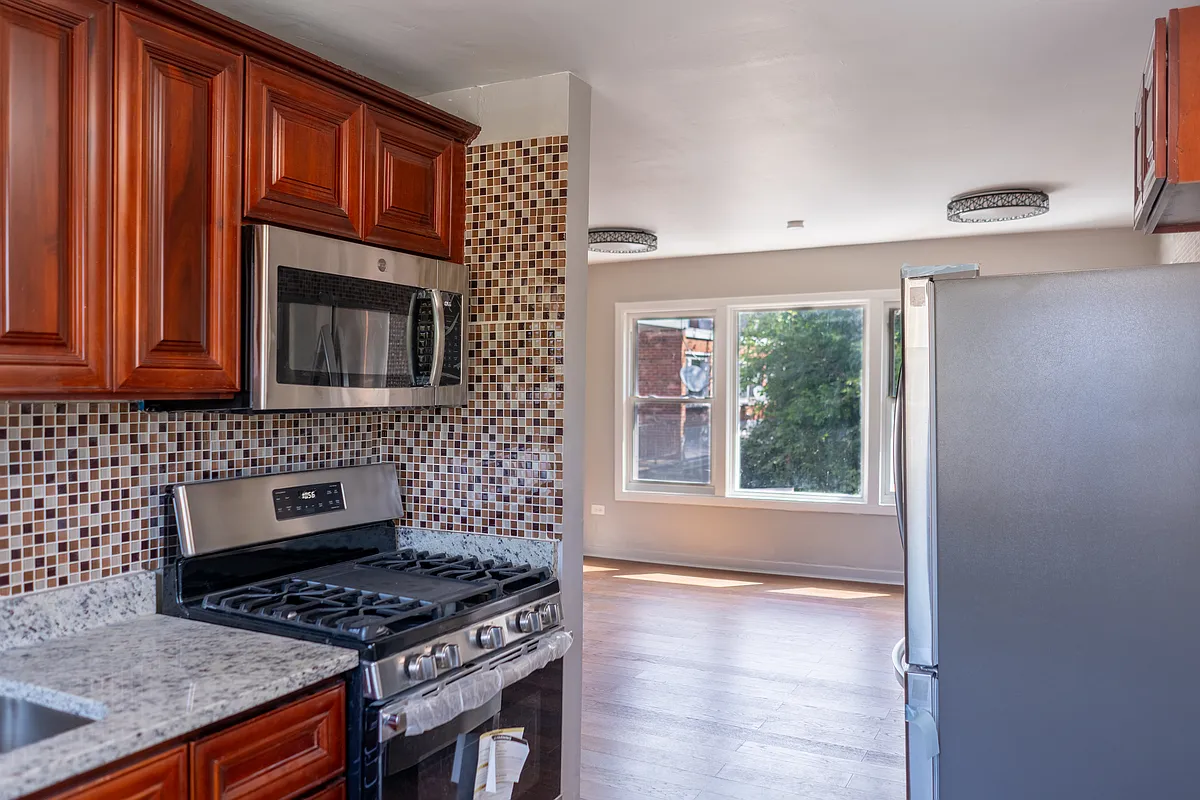 All new appliances in the kitchen. New refrigerator, microwave, dishwasher, gas stove, and even a coffee maker! - 3707 S Michigan Ave #2