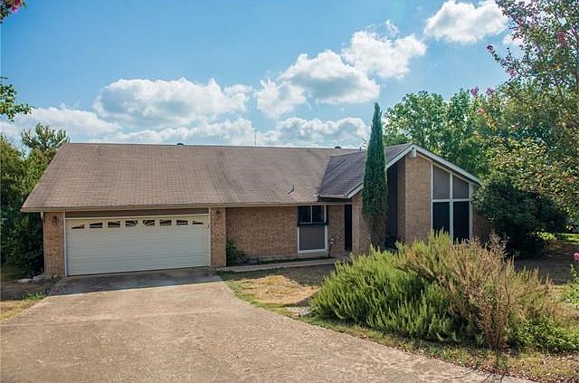 Room to park six cars in the driveway on this huge corner lot
