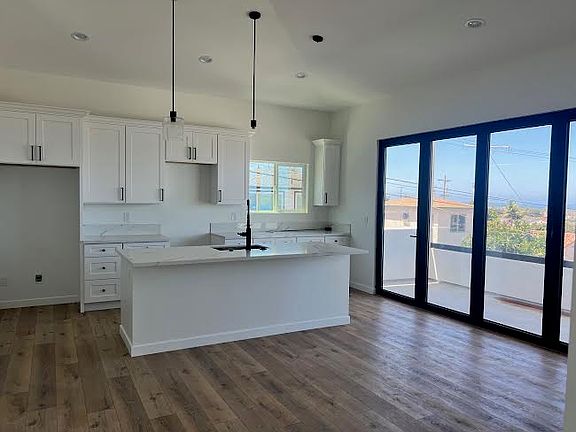 Kitchen w/ panoramic views of bay