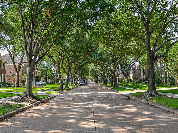 Curb appeal galore! Immaculate landscaping and mature trees give this charming home a welcoming feel from the moment you pull up.
