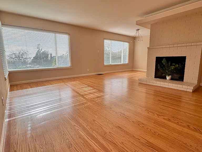The oversized picture windows in the inviting living / dining area offer an abundance of natural light.