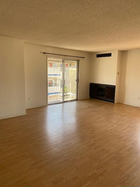 living room, California fireplace and balcony