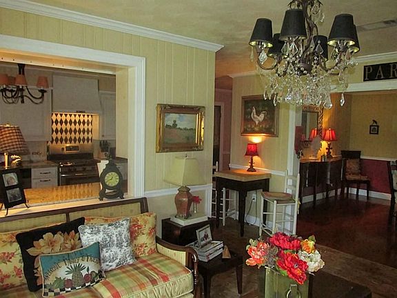 ENTRY-ECLECTIC AND UPDATED HOME. LIKE NEW WITH MANY UPDATES, ORIGINAL CEDAR PLANK WALLS, NEW CHAIR RAIL AND CROWN MOLDING, NEW FLOORING, AND ORIGINAL RESTORED CHICAGO BRICKS IN ENTRY